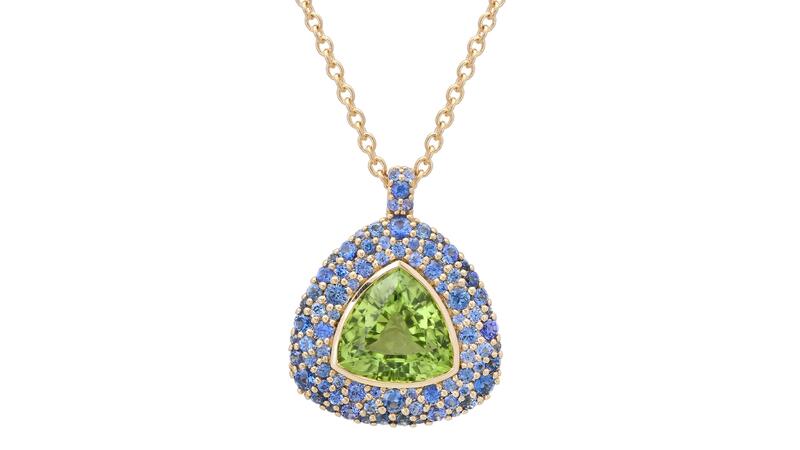 At the center of this pendant necklace is a vivid 3.31-carat peridot framed by brilliant-cut blue sapphire pavé in 14-karat yellow gold ($5,650) Eriness Peridot and Blue Sapphire Pendant Necklace