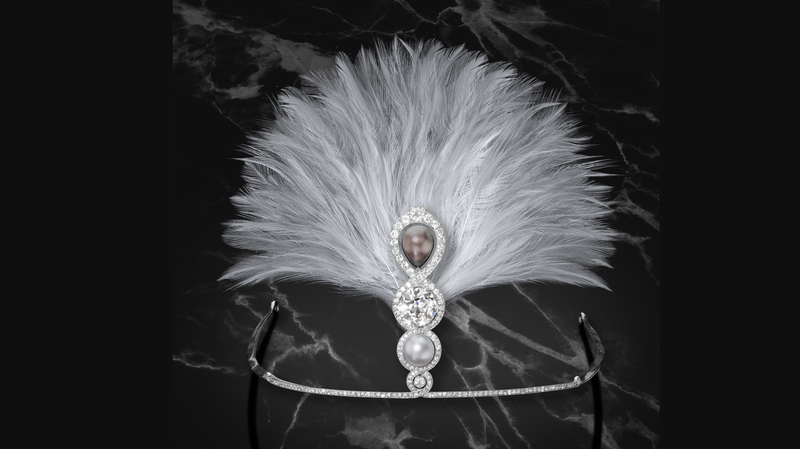 A Cartier diamond and natural pearl aigrette, New York, circa 1914. It features an 8.25-carat old European-cut diamond and two natural pearls with an additional 5.5 carats of diamonds mounted in platinum and steel. ($250,000-$450,000)