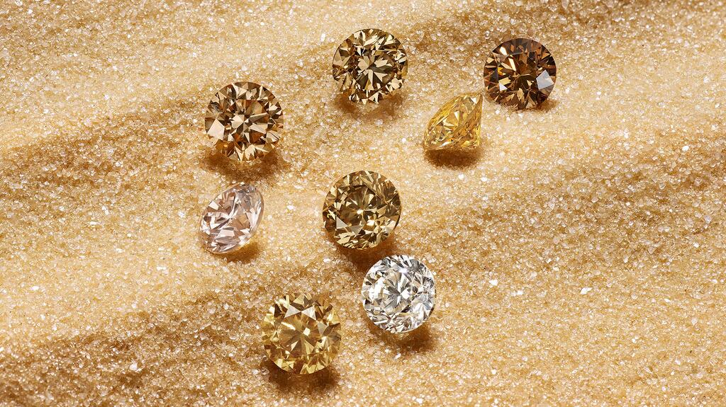 An image of loose diamonds De Beers Group provided for the launch of “Ombré Desert Diamonds,” its new beacon program focused on diamonds on the lower end of the color-grading scale (Photo courtesy of De Beers Group) Ombre Desert Diamonds loose diamonds