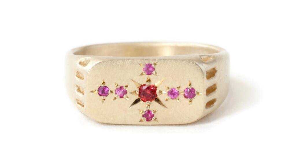 The “Eternal Light” signet ring by Linn. with red and pink sapphire set in 10-karat yellow gold with a matte finish ($1,775) Linn. Eternal Light Signet Ring