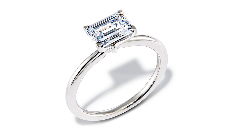 A white gold solitaire engagement ring by Kendra Scott with a 1-carat lab-grown emerald-cut diamond