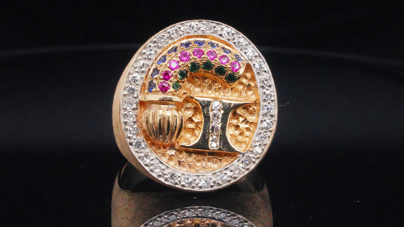 Hotel magnate Barron Hilton gave this 14-karat yellow gold ring with colored gemstones and diamonds (0.75 total carat weight) to Parker as a thank you for booking Elvis to perform in Las Vegas in the late ‘60s and ‘1970s, a residency that continues to shape Las Vegas entertainment today. The Hilton logo is featured at center and “COL” is engraved on the band. Minimum bid is $5,000. (Photo courtesy Kruse GWS Auctions)