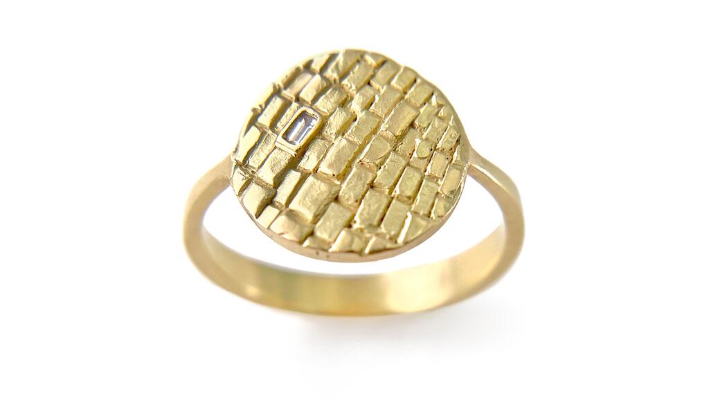 Kelsey Simmen’s 18-karat yellow gold “Sugar Brick” disk ring