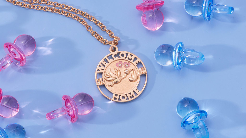 This “Welcome Home” pendant depicting a stork is a fitting gift for a new parent. Made in 14-karat gold with diamonds, it’s available with blue or peach enamel. It sells for $2,390 including the 18-inch cable chain.