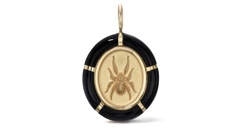 A Retrouvaí spider charm in 14-karat yellow gold with an onyx frame ($3,650) Retrouvai framed spider charm