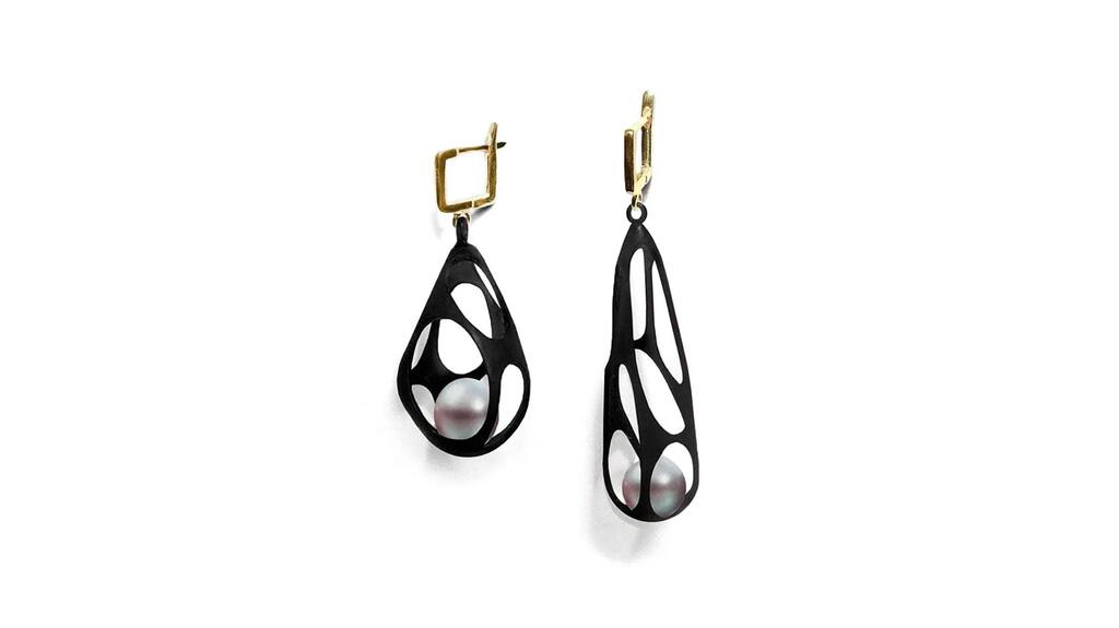 German Kabirski, designed by German Kabirski in Lake Worth, Florida. “Riona” pearl earrings in sterling silver with white shell pearls, plated in 18-karat yellow gold and black anthracite ($480) German Kabriski Riona pearl earrings
