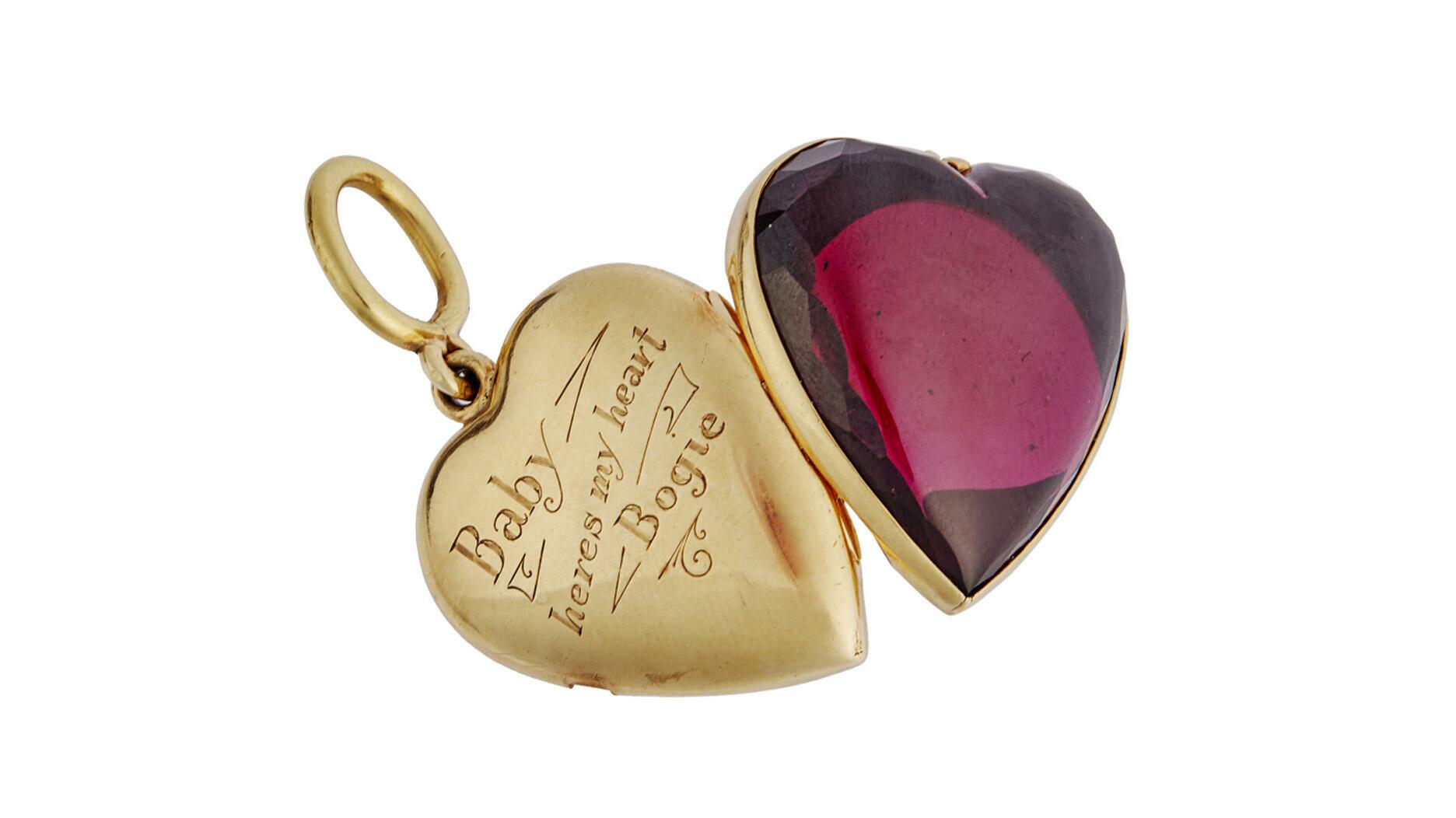 Humphrey Bogart gave Lauren Bacall this gold heart-shaped locket set with a simulated garnet and had it inscribed for her. A buyer paid nearly $60,000 for it at a recent auction of Hollywood memorabilia.