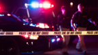 Stock image of police officers and crime scene tape