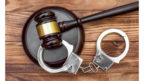 Stock image of handcuffs and gavel  
